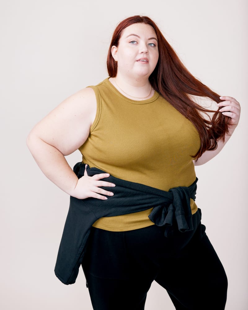 Front of a model wearing a size XXL Lise Ribbed Tank in Olive by ABLE. | dia_product_style_image_id:271465